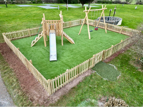 Wooden play area with swing and slide