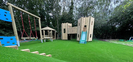 Outdoor playset with green slide