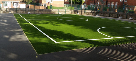 Artificial football pitch with line markings