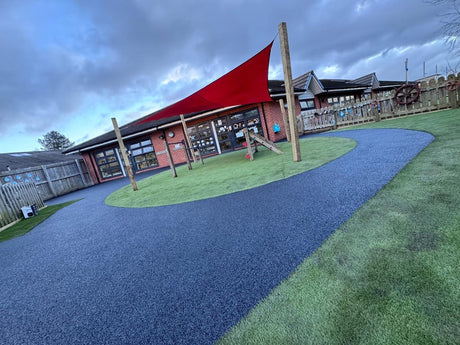 Outdoor play area with red canopy shelter